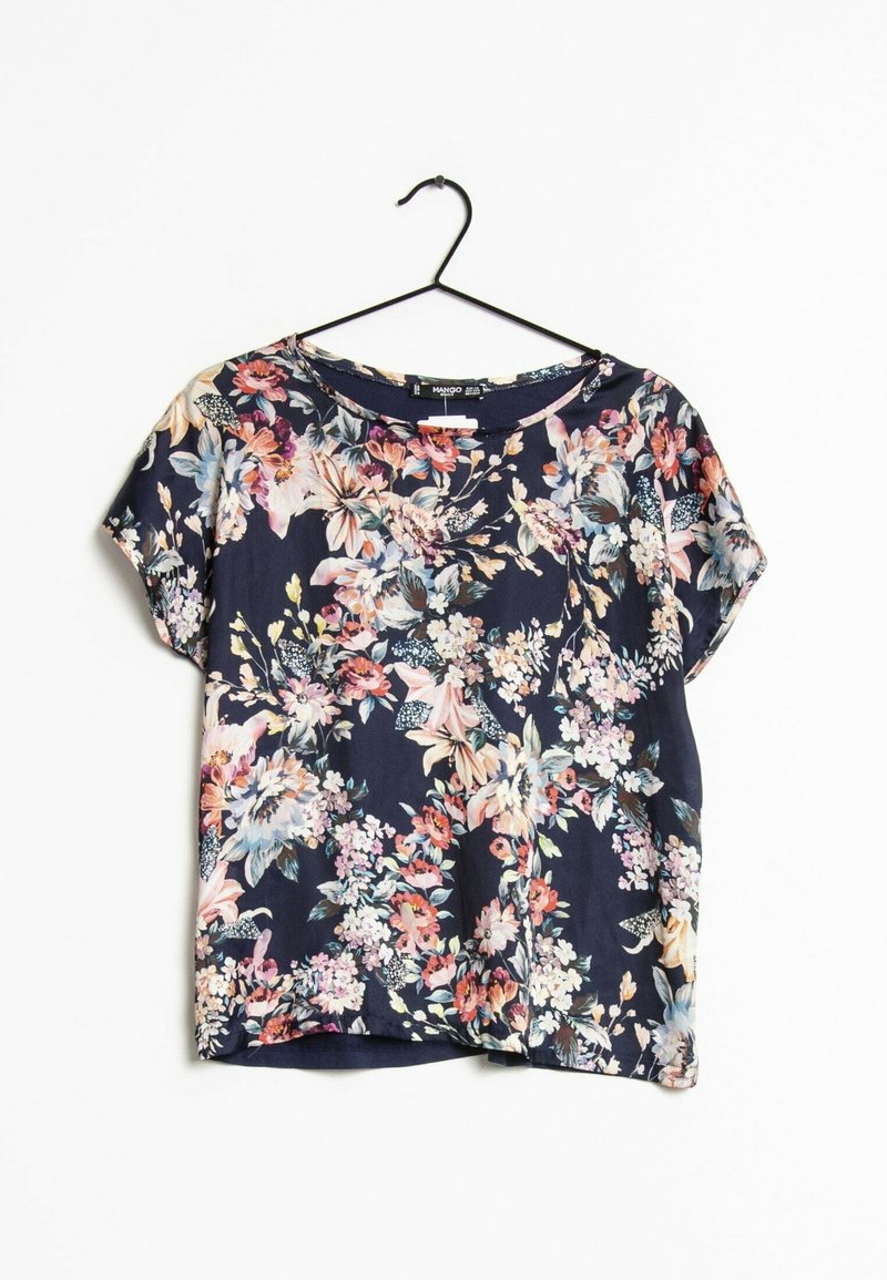 Blusa floreale a maniche corte con sfondo blu navy, caratterizzata da fiori vivaci nei colori rosa, blu e bianco. Realizzata in tessuto leggero e morbido.
