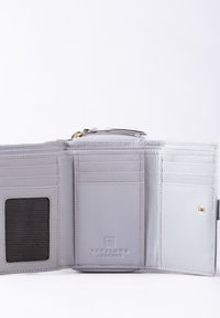 Gray leather wallet with multiple card slots, a mesh ID holder, and a zip compartment. Features embossed logo and gold hardware accents.