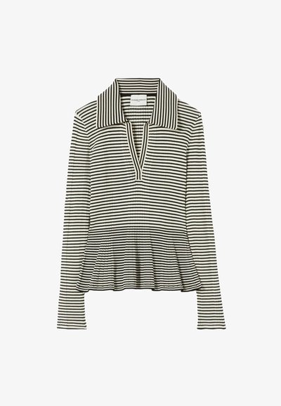 Top de manga larga a rayas blancas y negras con cuello de solapa y bajo estilo peplum. Hecho de un tejido acanalado con un corte holgado.