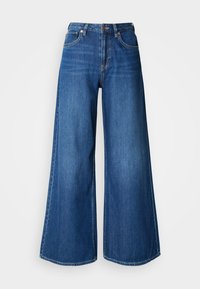 Μπλε τζιν παντελόνι φαρδιάς γραμμής από denim. Διαθέτει ψηλή μέση, καθαρές γραμμές και αντίθετη ραφή. Τα μπατζάκια φαρδαίνουν αισθητά στο τελείωμα.