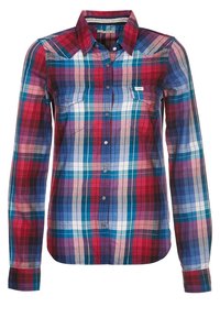 Plaid shirt with red, blue, and white check patterns. Features long sleeves, a pointed collar, and two front pockets with button closures.