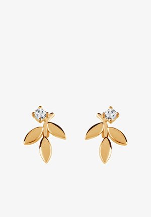 Złote kolczyki w kształcie liści z małym, okrągłym, przezroczystym kamieniem szlachetnym na górze, charakteryzujące się gładkimi powierzchniami i wypolerowanym wykończeniem.