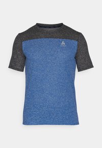 Short-sleeve athletic shirt with blue body and black shoulders, made from textured fabric, featuring a small logo on the front.