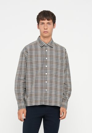 Brown checkered shirt with white and black lines, button-down collar, long sleeves, and a front pocket, made of soft fabric.