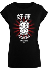 Musta lyhythihainen T-paita, jossa on valkoinen sarjakuvakissa kulhossa, punaiset säteet taustalla ja teksti "Good Luck Ramen Bar Tokyo."