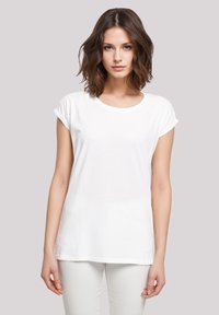 White cotton t-shirt with rolled short sleeves, a round neck, and a relaxed fit, displayed against a neutral background.