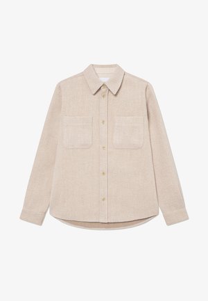 Beige flannel shirt with a pointed collar, two chest pockets, and gold buttons; features a textured fabric and rounded hem.
