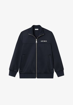 Veste zippée bleu marine avec col montant, poignets et ourlet côtelés, deux poches avant et logo « LES DEUX » sur la poitrine.