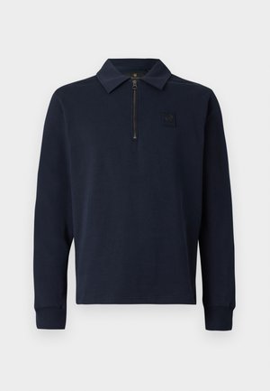Navy blue long-sleeve polo shirt with a half zipper and small patch logo on the left chest.
