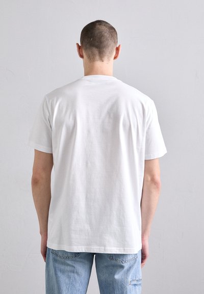 T-shirt en coton blanc à manches courtes, décolleté rond et texture lisse, vu de l'arrière. Pas de logos ni de motifs visibles.