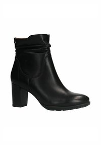 Bottines en cuir noir avec un design légèrement affaissé, bout rond et un talon épais et haut. Présente des coutures minimales et une texture lisse.