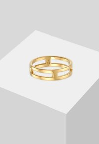 Gul ring med rektangulære udskæringer, poleret overflade og mærket med "925" indeni for sølvindhold. Glat, moderne design.
