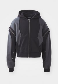 Hooded zip-up sweatshirt featuring a color-block design in black and gray. Made of soft fabric with ribbed cuffs and distinctive zippered accents.