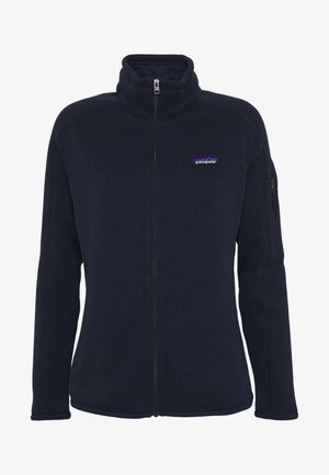 Marinblå fleecejacka med hög krage, hel dragkedja och broderad logotyp. Har en ficka med dragkedja på vänster ärm och ribbade ärmslut.