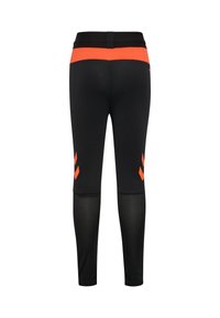 Svarta sportleggings med orange midjeband och detaljer, utrustade med meshpaneler och chevronmönster på nedre delen av benen.
