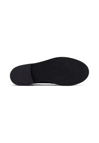 Semelle de chaussure noire avec talon lisse et motif circulaire texturé à l’avant-pied pour l’adhérence.