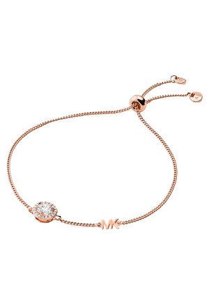 Armbänder aus roségold mit einem funkelnden, kreisförmigen Kristallmittelstück und verstellbarer Kette. Enthält ein kleines graviertes Logo-Detail.