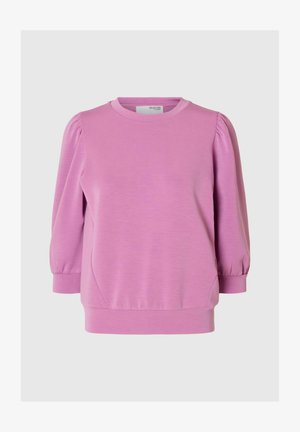 Ružičasti dukserica s okruglim izrezom, puf rukavima do tri četvrtine i opuštenim krojem. Napravljen od mekog, rastezljivog materijala s blagom teksturom.