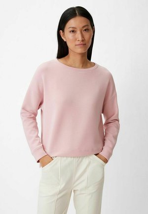 Light pink sweatshirt with long sleeves, round neckline, and a relaxed fit. Features ribbed cuffs and hem, made from soft fabric.