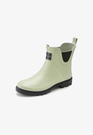 Green rubber ankle boot with black elastic gusset and pull tab at back, featuring a textured sole for traction.