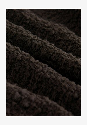 Dark brown textured fabric with a three-dimensional, wavy pattern, featuring soft, looped fibers that create depth and visual interest.