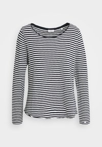 Camisa de manga larga a rayas en blanco y negro, de tejido suave, con escote amplio, dobladillo redondeado y aberturas laterales para mayor facilidad de movimiento.