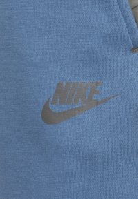 Nike Sportswear FUTURE UTILITY - Teplákové kalhoty - aegean storm