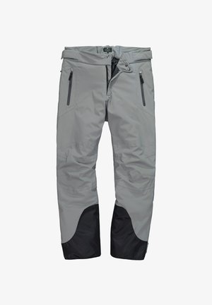 Pantalones impermeables de color gris claro con puños reforzados en negro, bolsillos con cremallera y cierre de cintura con doble botón a presión, diseñados para uso al aire libre.