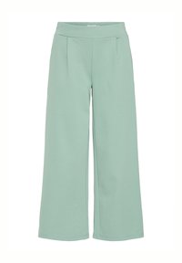 Lichtgroene wijde broek met een elastische tailleband, voorzien van zijplooien en een gladde stofstructuur in het geheel.