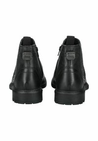 Stivaletti neri in pelle con una finitura liscia, chiusure con zip sul retro e un accento texturizzato con il logo Jeep su ogni tacco.