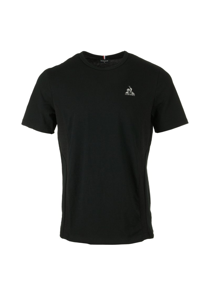 T-shirt noir à manches courtes en tissu doux avec un col rond. Présente un petit logo sur la poitrine et des panneaux latéraux texturés.