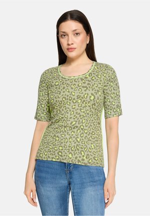 T-shirt à manches courtes, imprimé léopard vert avec un col arrondi, fabriqué en matière douce, doté d'une coupe légèrement ample et de détails de bord contrastants.