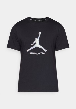 T-shirt in cotone nero con logo Jumpman riflettente e testo "SPORT" in grafica. Maniche corte e scollo rotondo classico.