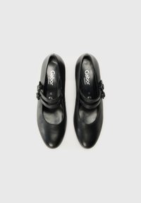 Black leather shoes with a rounded toe, a single strap featuring a decorative buckle, and cushioned lining. Gabor branded interior.