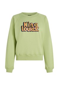 Felpa verde in cotone con polsini e orlo a costine. Presenta una grafica colorata "King Louie" in font rétro sul davanti.