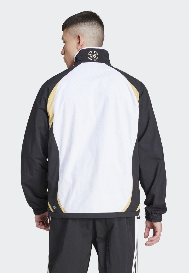 adidas Originals ADIDAS NTS RADIO ALLOVER PRINTED SUPERSTAR TRACK  