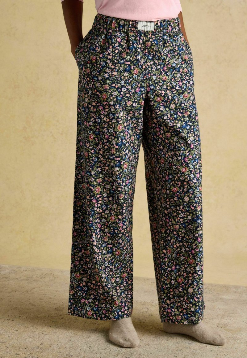 Kvetinové nohavice so širokými nohavicami v námorníckej modrej farbe s ružovými a zelenými akcentmi, s elastickým pásom a bočnými vreckami pre pohodlie a komfort.