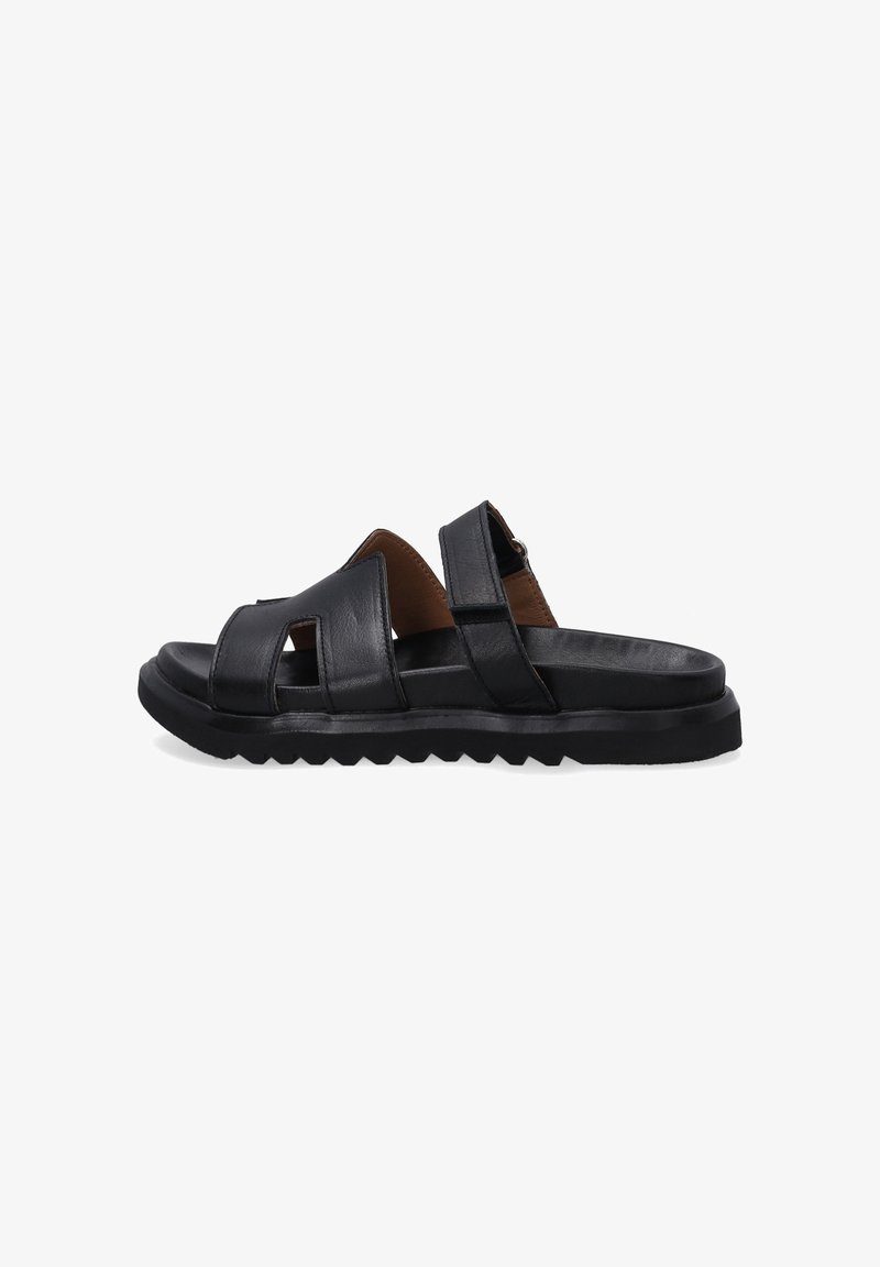 Black leather sandals with two wide straps, cut-out accents, and a textured rubber sole. Contoured footbed for comfort.
