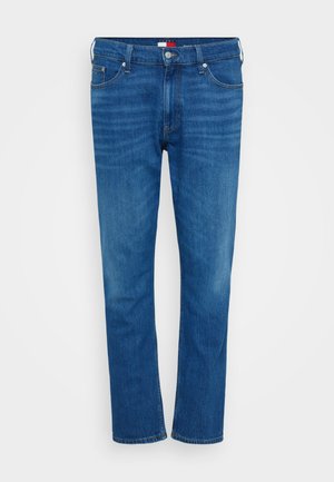 Sinised denim püksid otse lõikega, klassikalise viie tasku stiiliga, vöölõngad ja nööp sulgemine. Diskreetsed fading detailid.