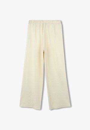 Crème-kleurige broek met wijde pijpen en een elastische tailleband. Zacht, glad materiaal met een lichte glans. Geen patronen of zichtbare hardwaredetails.