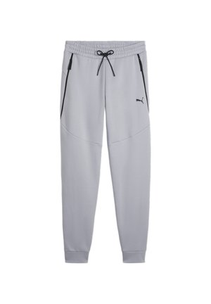 Pantaloni della tuta grigi chiari con una vestibilità affusolata, vita elasticizzata, cerniere laterali nere e un sottile dettaglio di cucitura triangolare. Logo sulla coscia sinistra.