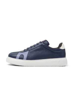 Navy blue leather sneaker with light blue side accents, white heel tab, white thick sole, and navy laces, viewed from the side.