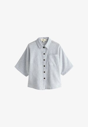 Helehall helikatega lühikeste varrukatega särk, millel on õhukesed vertikaalsed triibud, ees rinnanurkade tasku ja tumedad ümmargused nööbid.