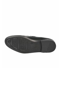 Suola di scarpa in gomma nera con un motivo di battistrada distintivo, comprese scanalature e sezioni rialzate per la trazione, e un leggero tacco sul retro.