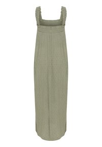 Robe verte clair, longueur genoux, avec un corsage froncé smocké, des bretelles froncées et un motif de points subtils. Texture de tissu douce.