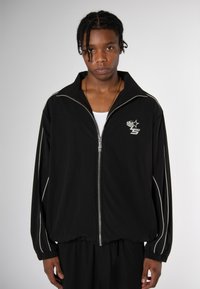 Love Scars COACH TRACK UNISEX - Treniņjaka - midnight purple