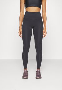 Under Armour MERIDIAN - Leggings - black
