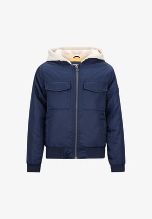 Marineblauwe gewatteerde jas met een witte capuchon en twee borstzakken, voorzien van een ritssluiting aan de voorkant en ribgebreide manchetten en zoom.