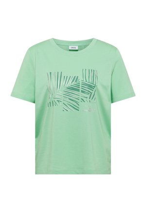 T-shirt vert clair à manches courtes avec un motif feuille de palmier argenté divisé en sections rectangulaires sur le devant et un col rond.