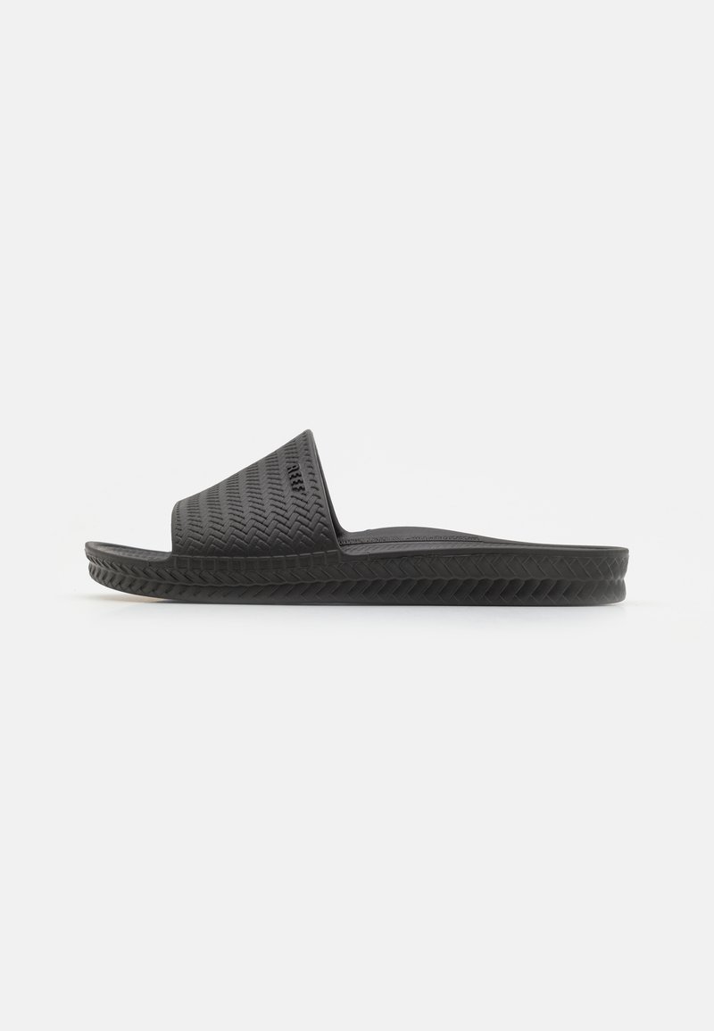 Black rubber slide sandal featuring a textured upper with a herringbone pattern, flat sole, and open toe design. Lightweight and casual style.